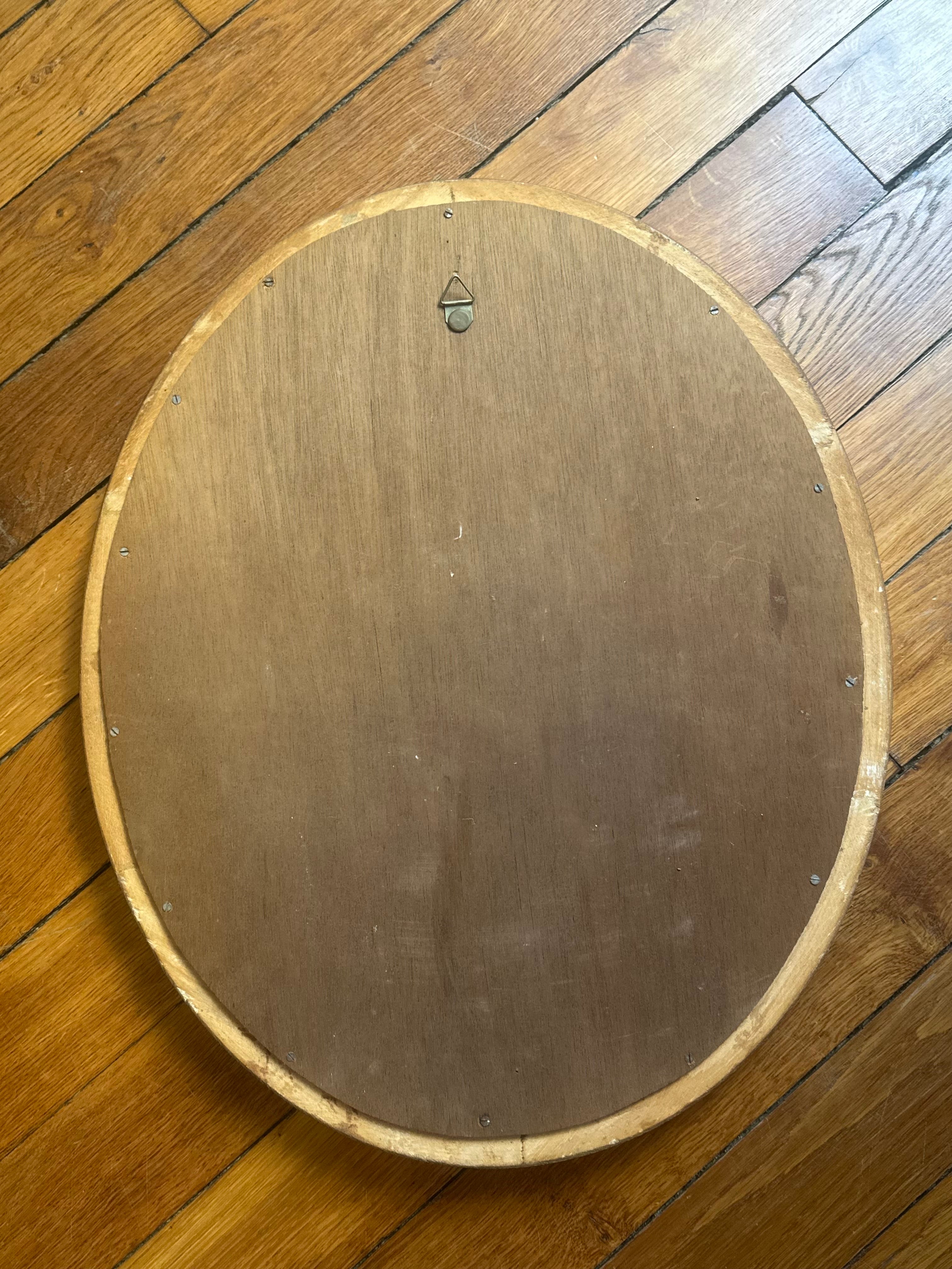 Miroir ovale sculpté